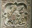 Panel 11:03 - Crouching man resting his chin on his hand