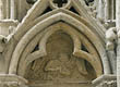 Panel 19:06 - Angel appearing over a cloud-frill with hands clasped in prayer